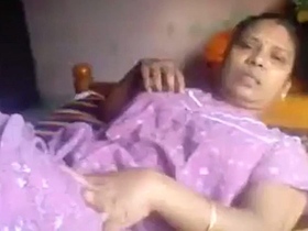 Elderly village woman engages in sexual activity with young man in explicit video