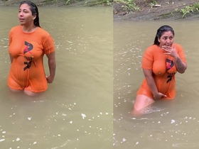 A beautiful woman shows off her large breasts in an alluring shirt