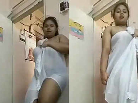 A stunning Indian babe flaunts her curves in a towel