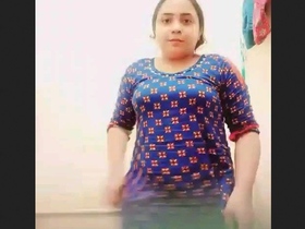 A stunning lady undresses and displays her flawless physique