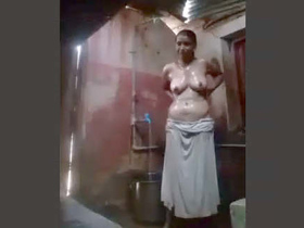Indian mature auntie takes a bath