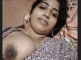 Indian bhabhi flaunts her boobs and pussy in a steamy video clip