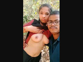 A South Asian couple basks in the sun as they pleasure each other with tit sucking in a rural setting