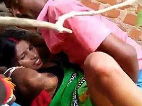 Village girl engages in sexual activity with her youthful companions outdoors