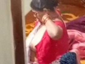 Mature Indian woman caught on camera while undressing