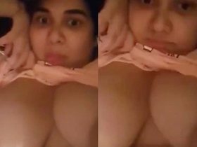 Desi wife flaunts her huge breasts in a seductive display