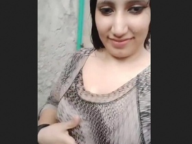 A Pakistani girl with large breasts becomes playful