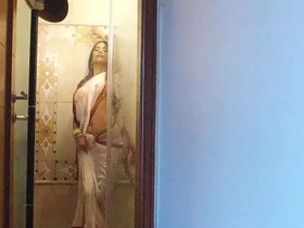 Devika's sizzling performance in her revealing striptease is a must-see