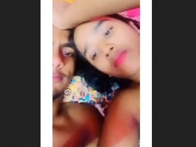 A charming and isolated young woman pleases her partner with an enthusiastic oral experience, showcasing her ample bosom.