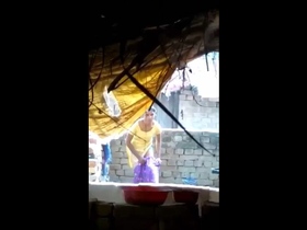 Indian beauty bathes outdoors in the sun