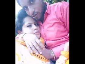 An enticing Indian girl with large breasts pleasures her partner with a sensual outdoor blowjob