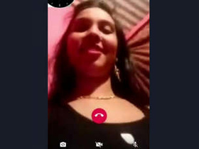 A beautiful Indian girl displays her large breasts and intimate area