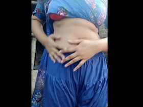 Stunning Indian belle pleasures herself and relieves herself in the restroom