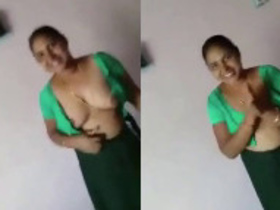 Indian aunt reveals her large breasts to a customer