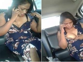 Tamil auntie flaunts her big boobs while driving