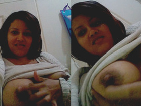 Aunty flaunts her breasts and nipples in a sensual display