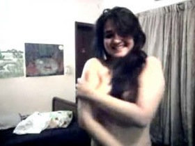 Seductive coed undressing