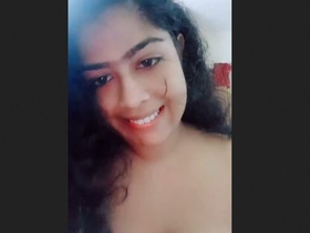 Indian college girl seductively displays her large breasts