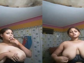 Desi bhabhi's big boobs and cigarette in village video