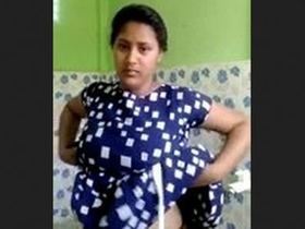 Beautiful Indian wife beautifies her face before bath