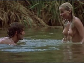 The iconic Bo Derek flaunts her bare buttocks on the shore