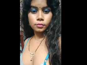 A naughty Indian wife reveals her breasts