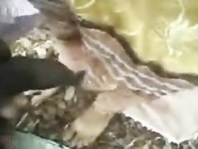 Outdoor video of a slender Indian girl giving her boyfriend a blowjob