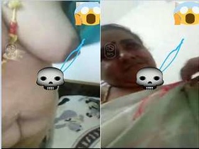 Busty Indian wife bares her breasts and pussy