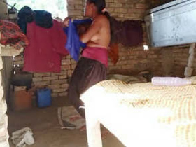 Village girl filmed while getting dressed after a bath