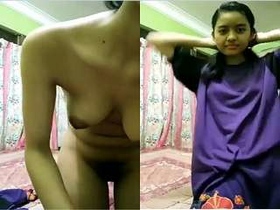 Exclusive video of a cute Indian girl stripping and revealing her assets