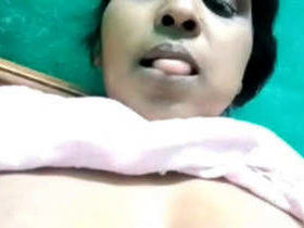 Aroused older woman pleasuring herself