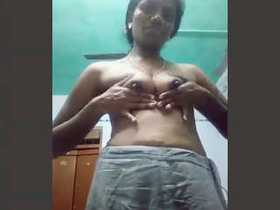 A sexually aroused middle-aged woman from the southern region strips and takes self-portraits