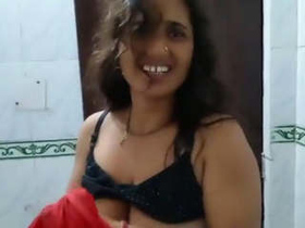 Desi bhabhi takes a bath and pleasures herself by talking