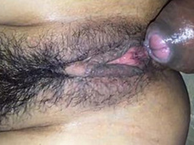 Close-up view of a hairy pussy getting fucked in a desi video