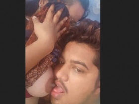 Lover sucks on girlfriend's breasts in sensual video