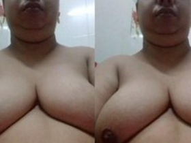Bhabhi flaunts her large breasts in a seductive manner