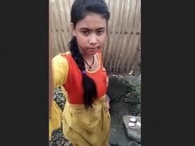 Young village girl takes a bath