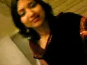 A gorgeous woman wearing a sari performs a passionate oral sex act