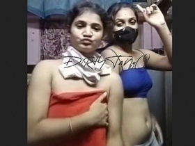 Sensual lesbian tango performance in a group setting