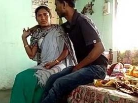Desi aunty has sex with her son's friend in this steamy video
