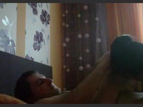 A youthful pair engages in intense romantic activity