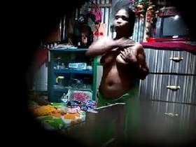 Desi bhabhi's large breasts captured in secret