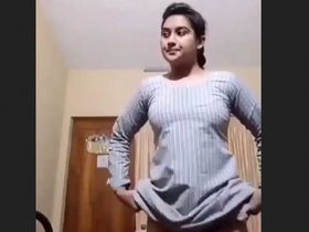 Indian bhabi teasingly uncovering her dress for the camera