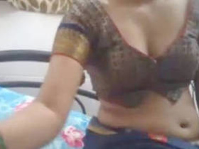 Indian desi girl in saree gives a cam show with her blouse