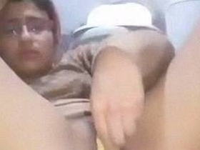 Indian girl masturbates with a banana and dildo