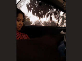 A lovely young woman performs a seductive oral sex act inside a vehicle