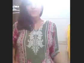 A man strips naked in the bathroom and shows off his body