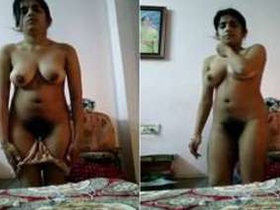 Desi Indian girl strips and masturbates in front of the camera