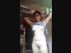 Watch a beautiful Indian teen strip down to her lingerie