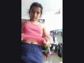 A young Indian woman takes a nude self-portrait